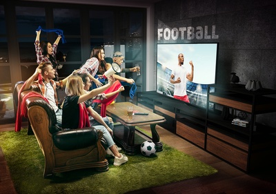 Friends watching football goal