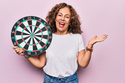 Woman Holding Dart Board