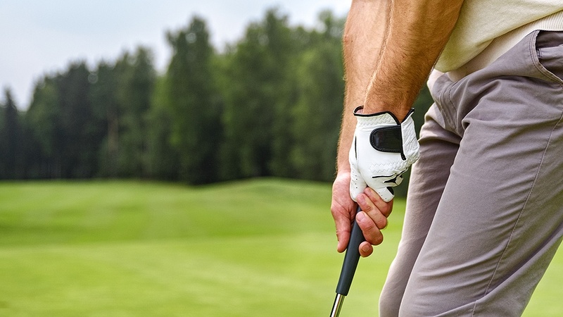 Man Holding Golf Club