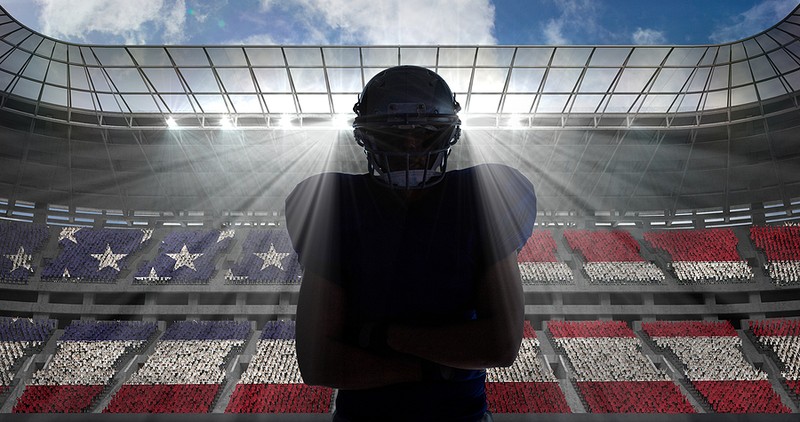 American Footballer Facing Stadium