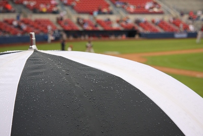 Umbrella at Rainy Baseball Game